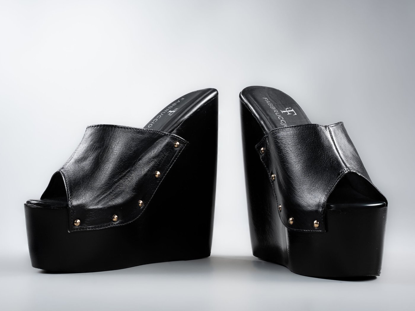 Amber wedge mule, open-toe front view and brass stud detail