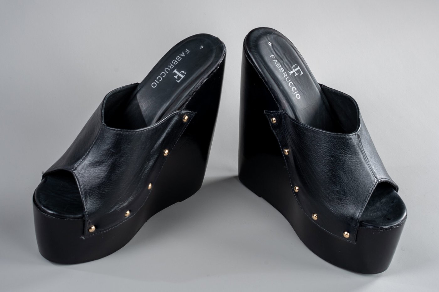 Amber wedge mule, three-quarter view showing the solid wood wedge