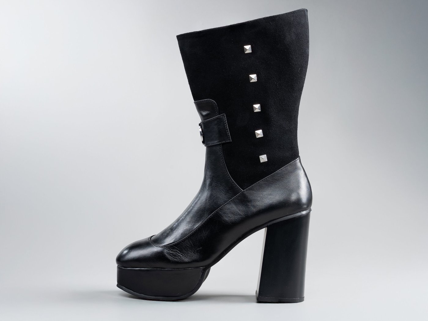 Valentina Black, side profile showing knee-high silhouette and vertical flush studs