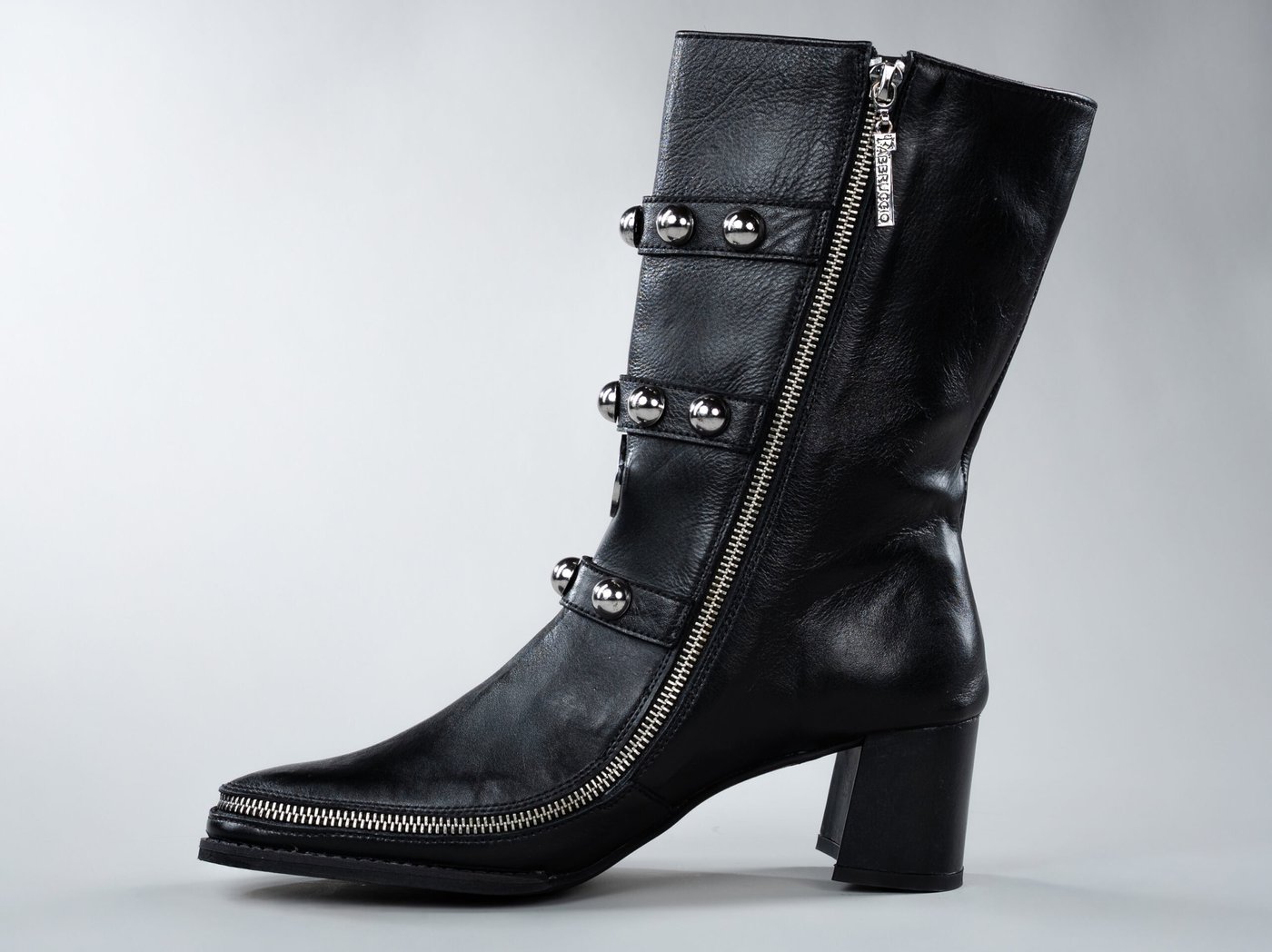 Vivienne Black, side view showing strap placement and cherry-red lining